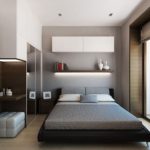 Lit bas dans la chambre grise