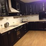 Noble dark cuisine and a beige delicate apron - simple and not corny