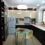 Original wenge cabinets with glass inserts in the beige kitchen