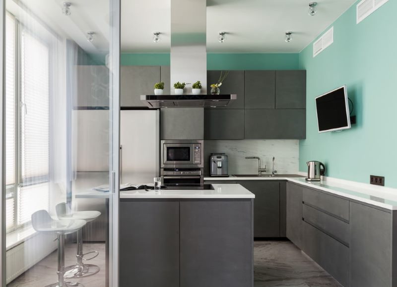 Turquoise walls in the kitchen with a gray set