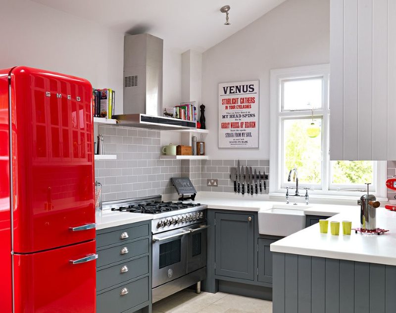 Red retro fridge in the faith kitchen of a private home