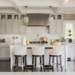Light gray kitchen with island in a private house