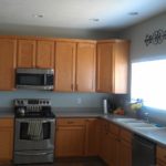 Brown furniture on a background of gray walls