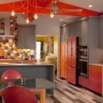 The combination of gray and red in the interior of the kitchen