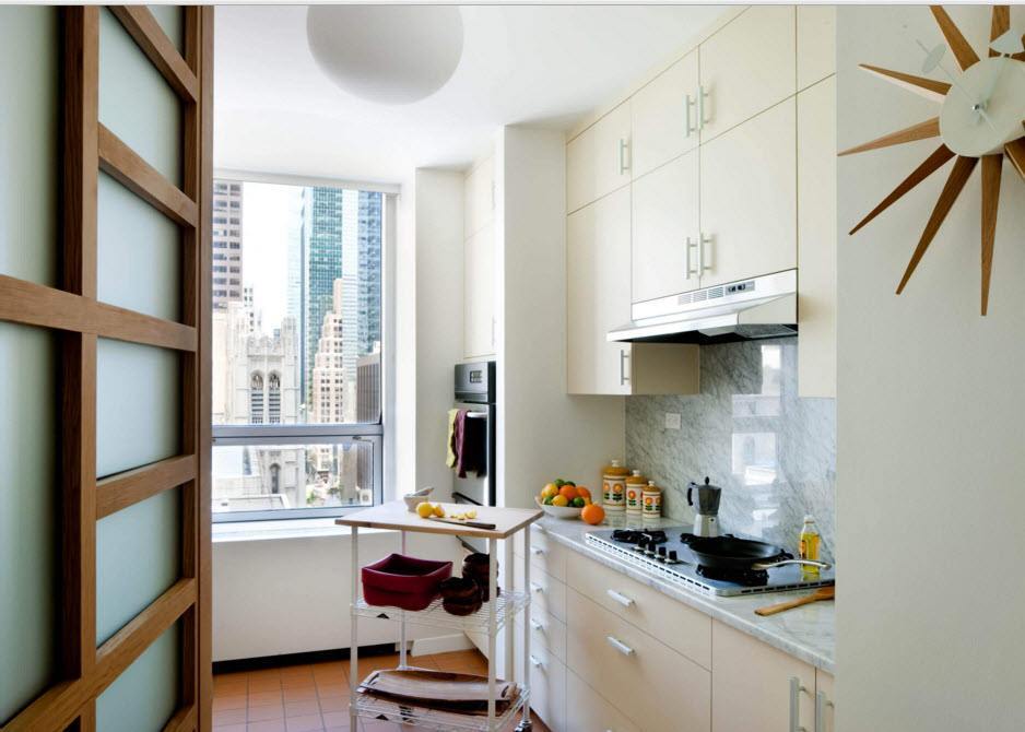 White cupboard to the ceiling in a small kitchen