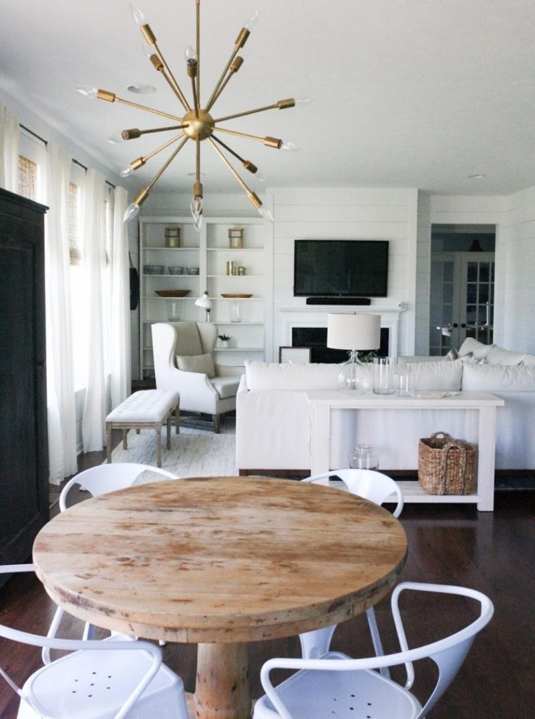 White chairs with armrests in a modern kitchen