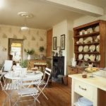 Porcelain dishes on the shelves of a wooden cabinet