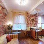 Colorful wallpaper on the wall of the kitchen-living room