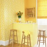 Yellow wallpaper in the design of the kitchen