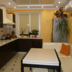 Yellow walls in the interior of the kitchen