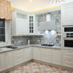 Corner kitchen with white furniture