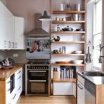 Kitchen utensils on wooden shelves