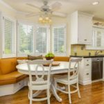Kitchen with sofa in a bay window of a country house