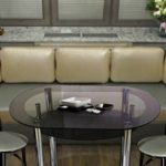 Two chairs on the sides of an elongated table