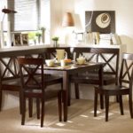 Dark furniture in a bright dining area