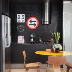 Black plywood chairs in a kitchen interior