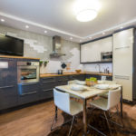 Corner kitchen interior with dedicated dining area