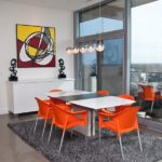 Orange chairs at the dining table