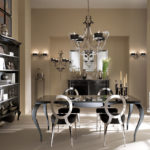 Chandelier on the ceiling of the kitchen with beige walls