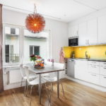 Yellow apron in a snow-white kitchen