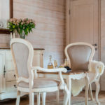 Fur cape on the armrest of the kitchen chair