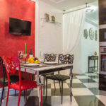 Black tv on the red wall