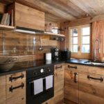 Glass panel on a wooden kitchen apron