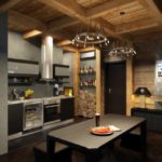 Gray kitchen in a wooden house