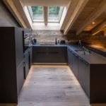 U-shaped kitchen in the attic of a hunting lodge