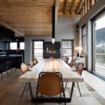 Wooden table in the kitchen with panoramic window