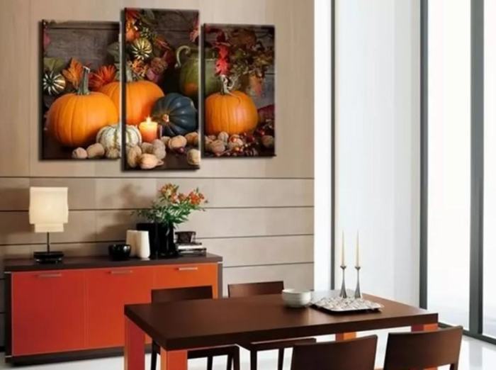 Pictures on the wall of the kitchen.