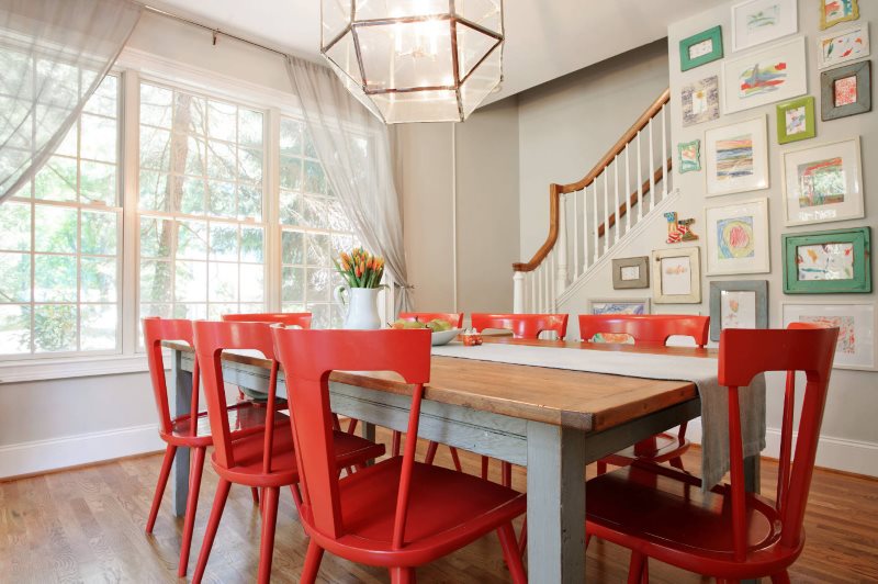 Red chairs in the interior of the kitchen of a private house