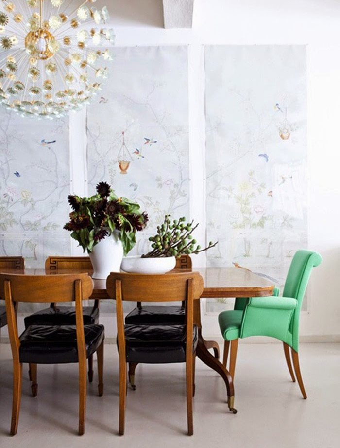 Upholstered chair with green armrests