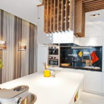 Wooden lamp in the interior of the kitchen