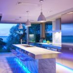 Blue highlighting the marble surface of the kitchen island