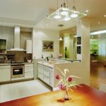 Bright lighting of the kitchen-dining room in a private house