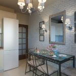 Large mirror on a brick wall