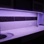 A dark strip on a tiled apron