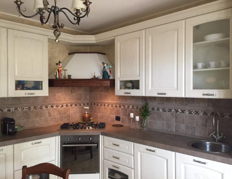 Small kitchen with a gas stove in the corner