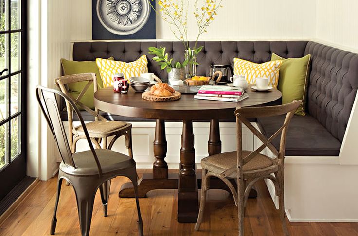 Different chairs around the round table in the kitchen