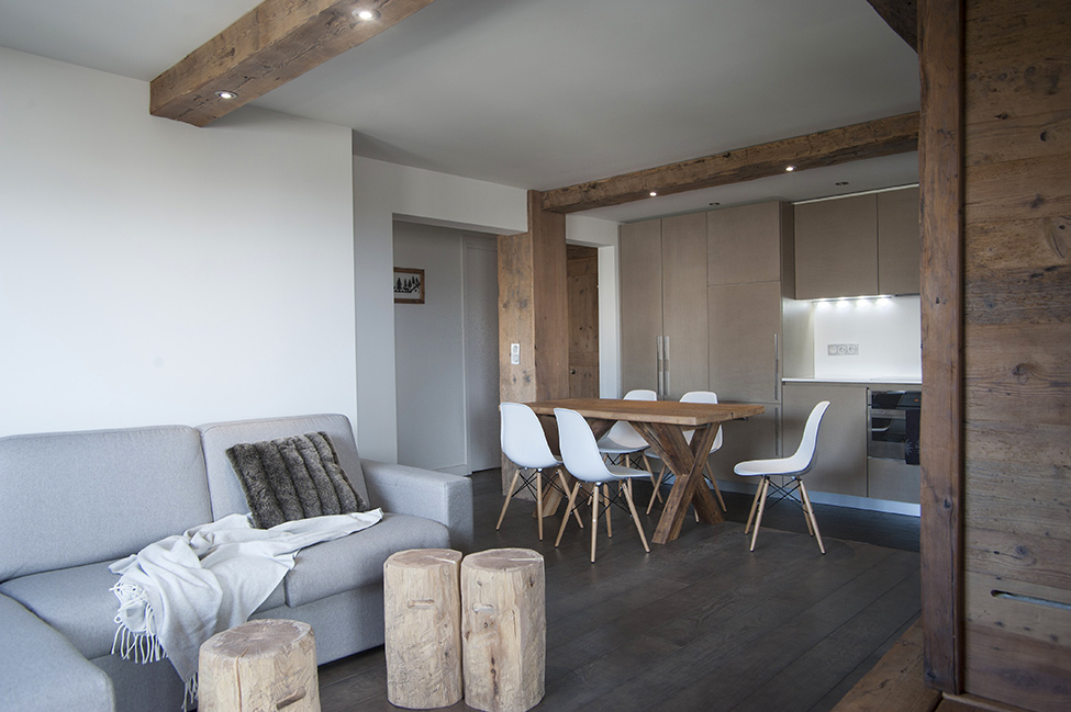 Wooden beams on the plain kitchen ceiling