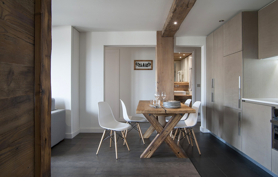Wooden table in the kitchen of a city apartment in a chalet style
