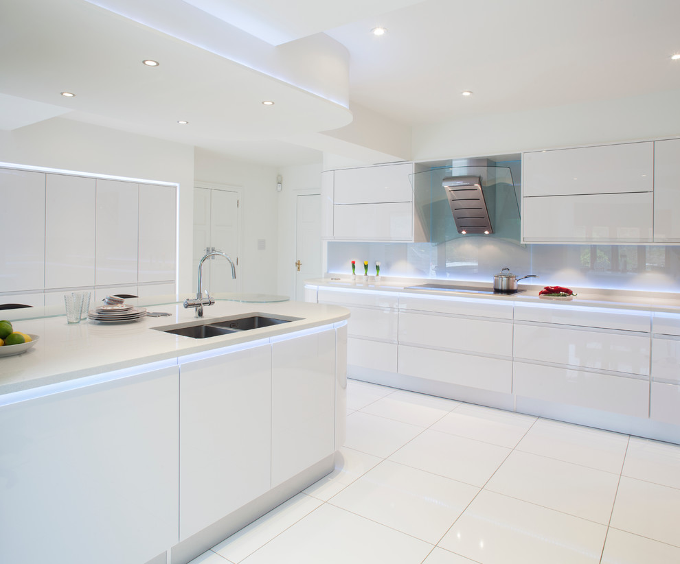 Recessed lighting on the ceiling of a snow-white kitchen
