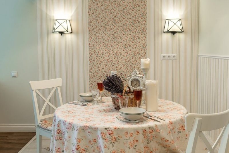 Zoning of a place for dinners with the help of wallpapers with different ornaments