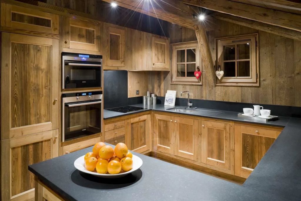 Built-in appliances in the corner chalet-style kitchen