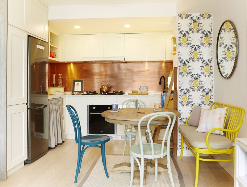 Blue chair in a modern kitchen and a daybed with armrests