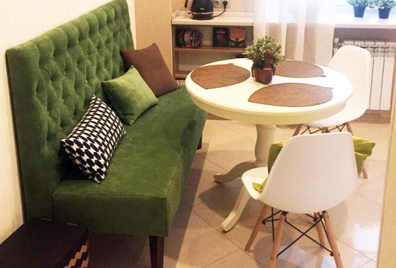 Green sofa with high soft back