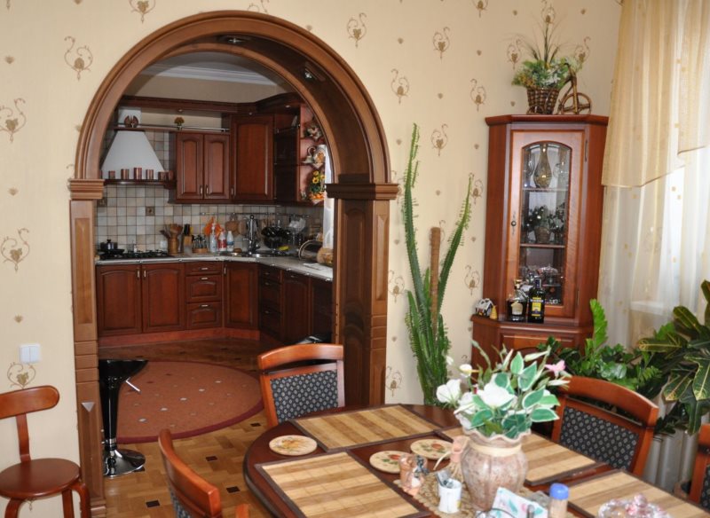 Dining table in a room with a wooden arch