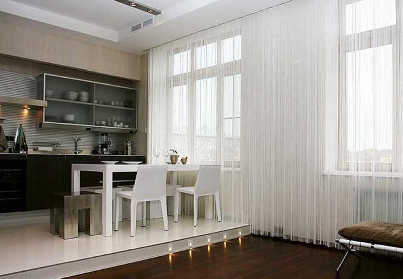 Translucent white curtains in a room with a podium.
