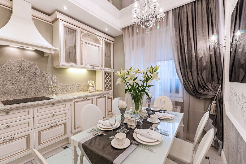 Gray curtain on the kitchen window in a city apartment